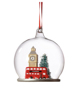 a glass ball with a red bus and a clock tower inside